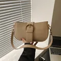 Minimalist beige PU leather underarm bag featuring a vintage round bronze buckle strap - Khaki