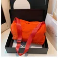 Orange cylinder nylon messenger bag with red strap and embroidery in a black gift box - Orange