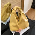 Fashionable ginger yellow pleated bucket bag with a stylish knotted handle for women - Yellow