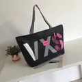 Black large capacity tote bag with VXS letters and pink zipper detail for travel - Black