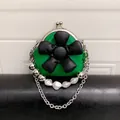 Mini green crossbody bag for kids featuring a 3D black flower and pearl chain strap - Green