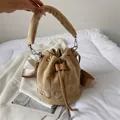Camel faux fur bucket bag featuring plush texture and THE BUCKET letter embroidery - Khaki