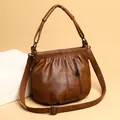 Vintage brown pleated crossbody bag for women with top handles and woven shoulder strap - Brown
