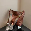 Dark coffee soft tote bag with ethnic style woven wide shoulder strap for daily casual use - Brown