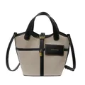 Borsa a secchiello in tela beige con finiture in pelle nera e lucchetto dorato - Nero