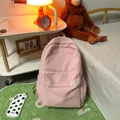 Minimalist light pink school backpack with cute cartoon bear tag and spacious storage - Pink