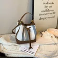 Retro striped bucket bag in blue and white canvas with premium brown leather trim - Blue