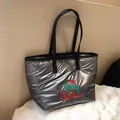 Quilted silver metallic tote bag with Merry Christmas embroidery and red holiday hat - Gray