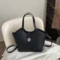 Minimalist black matte leather tote bag with silver buckle and removable strap - Black