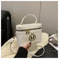Chic milky white box-shaped crossbody bag with gold M-logo and adjustable strap - White