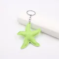 Vibrant lime green leather starfish keychain charm with intricate white stitching for bags - Fluorescent Green