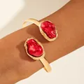 Adjustable golden bangle featuring baroque irregular red stones and a polished finish - Gold Baroque Red Bead Open Bracelet