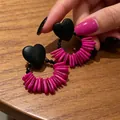 2604206 Black Heart Wooden Earrings With Pink Beads