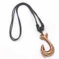 Maori style resin fish hook necklace with brown carvings and black braided cord - Fish Hook Style (E) / Red Brown
