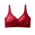 Macro shot of seamless red V-neck bra showing soft jelly strip support and fabric texture - Red
