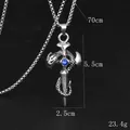 Collier croix gothique argenté avec serpent et pierre bleue sur fond noir mat - Zircone Bleue