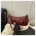 Retro dark red PU leather shoulder bag with glossy finish and double front pockets - Red