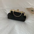Elegant vintage black evening clutch with gold metal handle and sparkling glitter finish - Black
