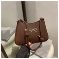 French vintage dark brown shoulder bag with golden bow clasp and knot strap - Coffee