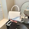 White minimalist crossbody handbag with textured weave flap and silver metal detail - White