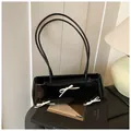 Glossy black shoulder bag with delicate white bows and a vintage chic aesthetic - With Pendant / Black