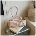 Light pink underarm bag with silver bows and pearl charm on vintage background - With Pendant / Pink