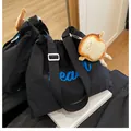 Black canvas tote bag with blue Beach lettering and cute plush toast keychain accessory - With Pendant / Black