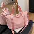 Light pink waterproof nylon travel duffel bag with detachable shoulder straps - Pink