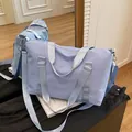 Light blue large travel duffel bag made of waterproof oxford cloth with shoulder strap - Blue
