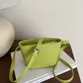 Lime green leather bucket crossbody bag with adjustable strap and embossed logo detail - Green