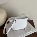 Minimalist white leather bucket bag with silver buckle and adjustable shoulder strap - White