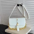White faux leather crossbody bag with chunky gold chain and padlock detail for summer - White