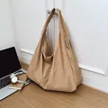 Light brown nylon tote bag with pleated texture and wide strap for casual commuting - Khaki