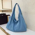 Sky blue large capacity tote bag with wide shoulder strap and drawstring detail - Blue