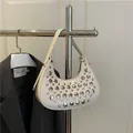 Chic white hobo underarm bag with silver studs on glossy faux leather - White