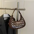 Dark brown crescent shoulder bag with silver rivet studs and a glossy faux leather finish - Coffee