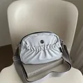 Off-white pleated crossbody bag with wide strap and M FASHION metal logo detail - Gray