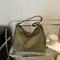 Olive green suede tote bag with brown leather straps and vintage metallic rivets - Green