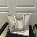 White letter print tote bag with white leather straps and gold metal R charm - White
