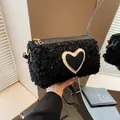 Minimalist black sherpa cylinder crossbody bag with heart patch and golden hardware - Black