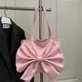 Pink fashion shoulder bag featuring an oversized decorative bow in Korean style - Pink