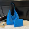 Electric blue suede hobo tote bag set with matching zippered pouch on white surface - Blue