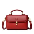 Elegant wine red leather square handbag with golden clasp and embossed letter F detail - Red