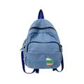 Mini light blue washed denim backpack with navy straps and colorful striped patch - Regular / Sapphire Blue