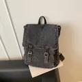 Vintage dark gray washed denim backpack with adjustable straps and metal buckles - Black