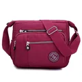 Burgundy nylon crossbody bag with multi-zipper pockets and adjustable shoulder strap - Burgundy