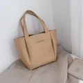 Light beige large capacity leather tote bag with open front pocket and minimalist design - Beige