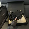 Elegant black sequined crossbody bag with gold chain strap in premium gift packaging - Black