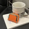 Mini orange lychee grain leather coin purse with golden metal clasp for jewelry - Orange