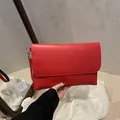 Red matte faux leather envelope clutch bag with silver hardware and wrist strap - Red